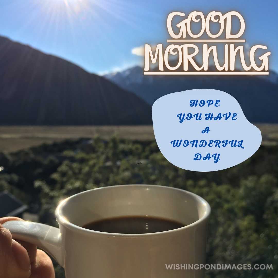 Enjoying a cup of coffee at the mountain range. Good Morning Coffee Images